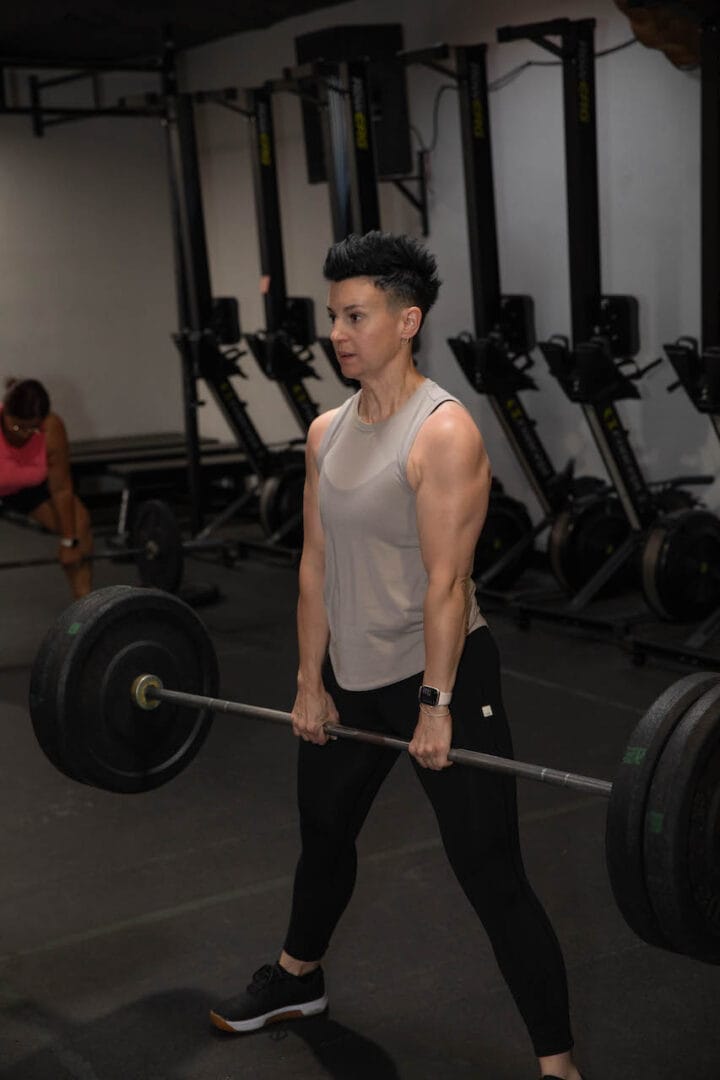 Personal trainer in Tucson teaching correct deadlift technique with focus on position, movement, speed, and intensity at Telos Strength & Conditioning