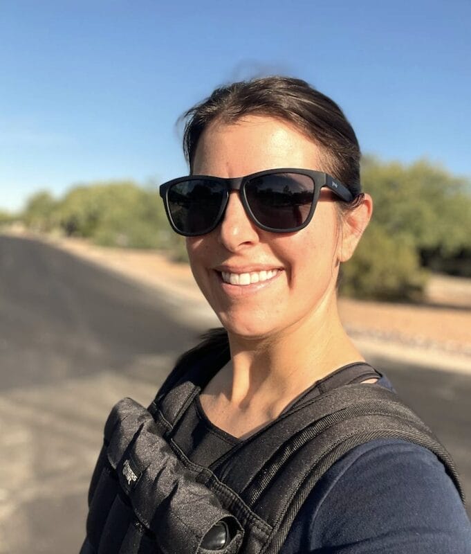 Woman rucking with weighted vest on neighborhood walk